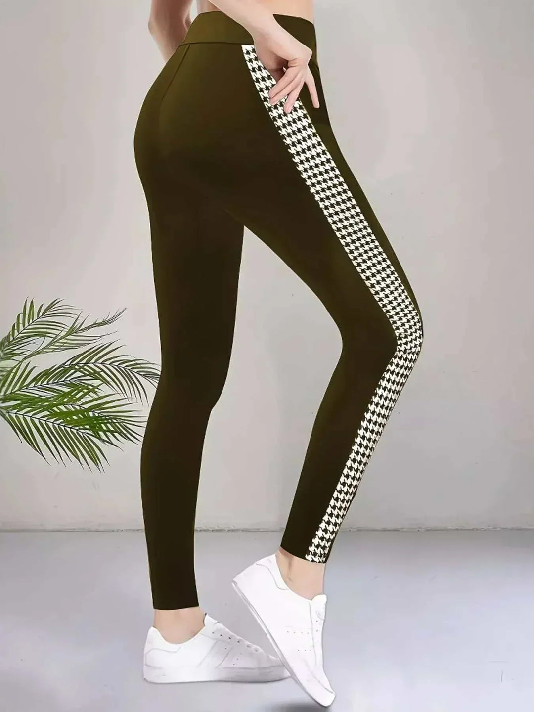 Women’s Houndstooth Leggings in green stretch fabric with a high waist and bold black-and-white patterned side stripe