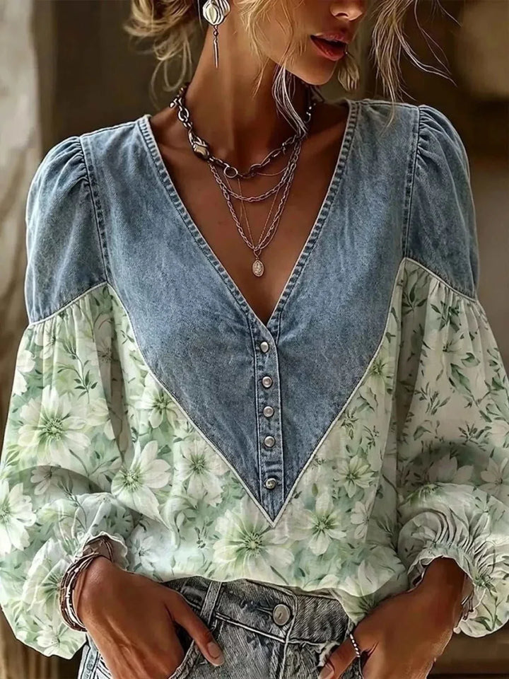 Women’s Plus Size Floral Denim Top with a faded blue denim V-neck yoke, button front, puff sleeves and pale green floral print