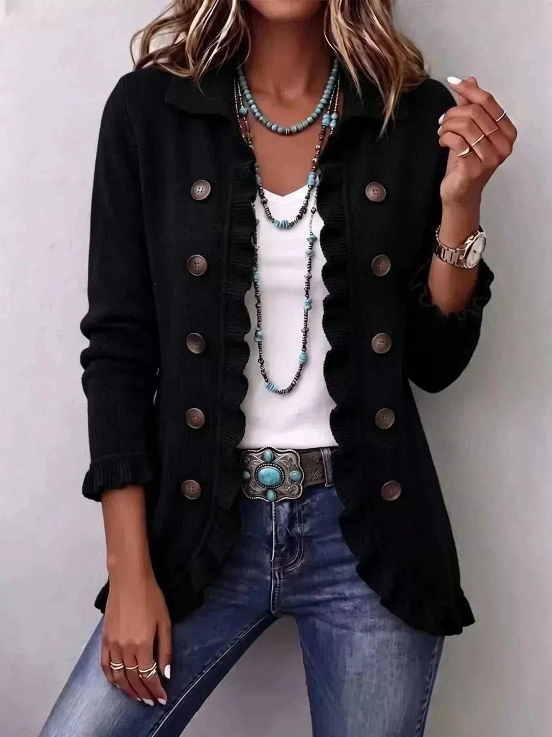 Women’s Plus Size Ruffled Cardigan in black knit with scalloped ruffled edges, long sleeves and decorative brown buttons