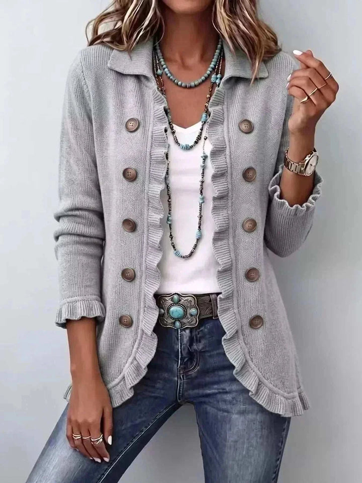 Women’s Plus Size Ruffled Cardigan in light gray knit with brown buttons, ruffled front trim and cuffs