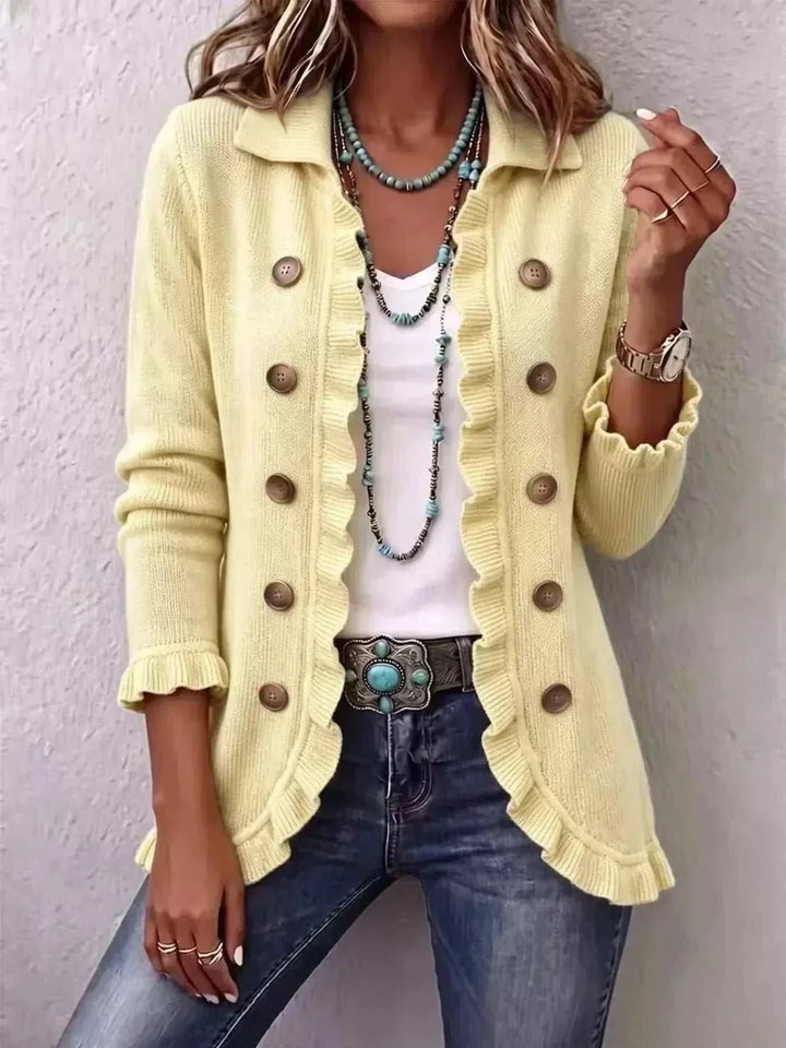 Women’s Plus Size Ruffled Cardigan in pale yellow knit with a collared neckline, brown buttons and ruffled trim
