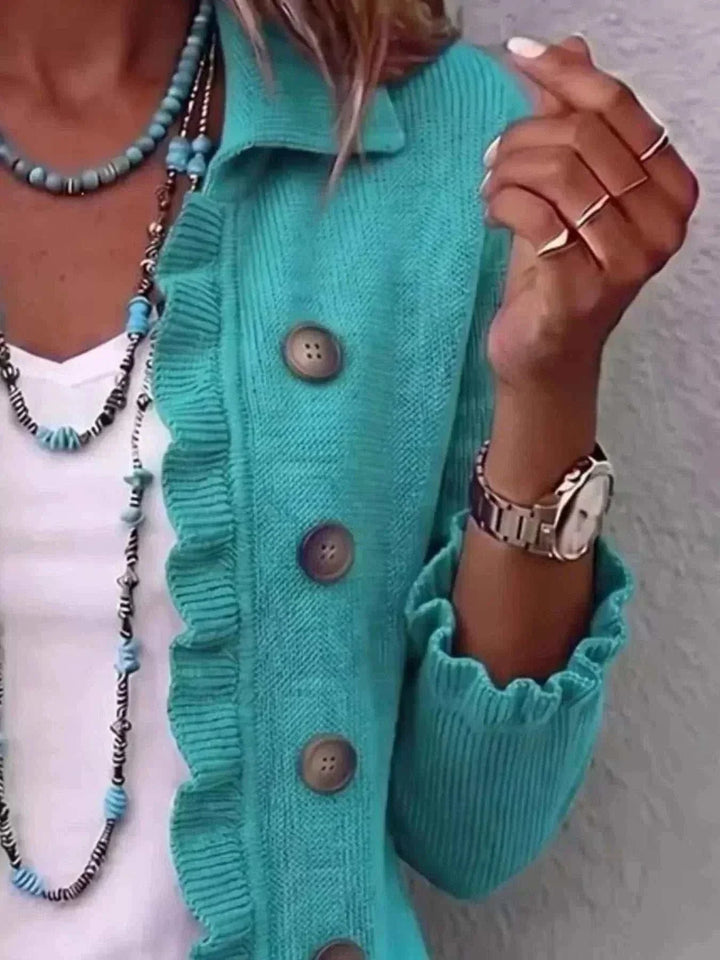 Women’s Plus Size Ruffled Cardigan in turquoise ribbed knit with brown buttons, ruffled trim, and gathered cuffs