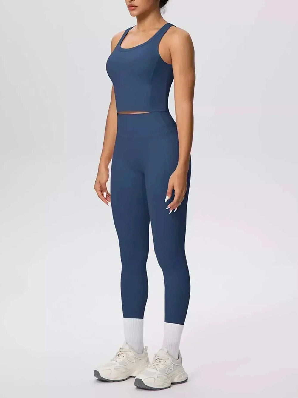 Women’s Tank and Leggings Set in solid navy blue stretch fabric, with a cropped scoop-neck tank and high-waisted leggings.