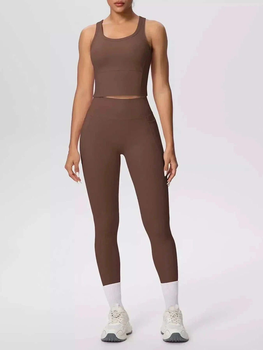 Women’s Tank and Leggings Set in solid brown stretch fabric, featuring a scoop-neck cropped tank and high-waisted leggings.