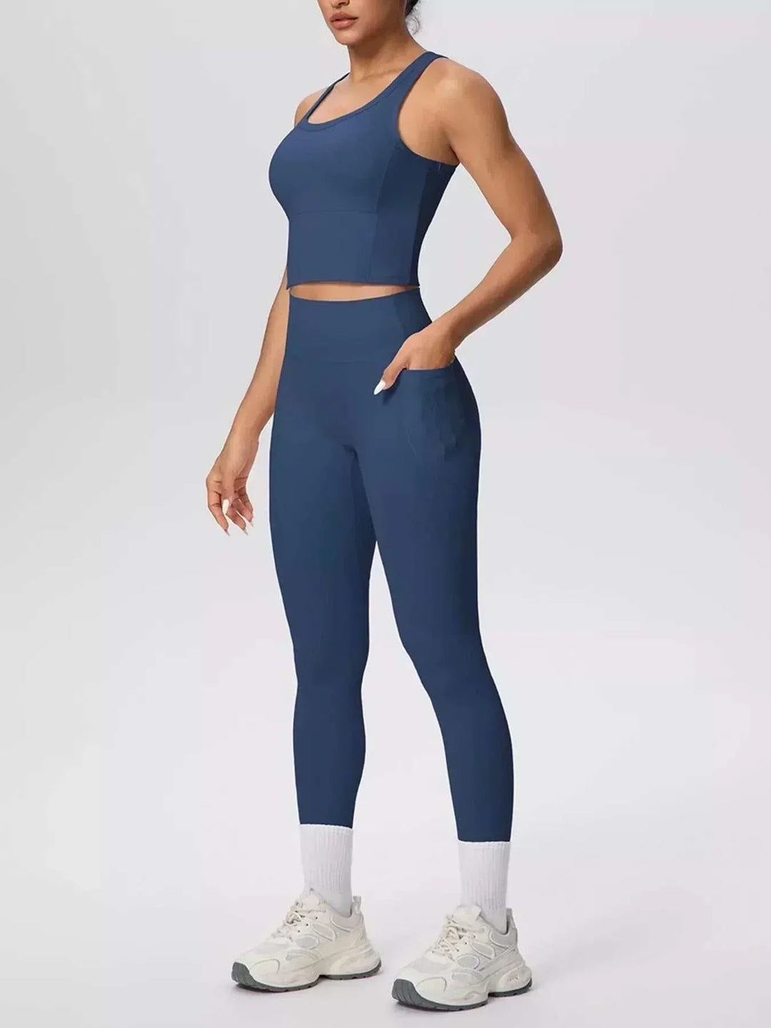 Women’s Tank and Leggings Set in solid navy blue stretch fabric, with a cropped scoop-neck tank and high-waisted leggings