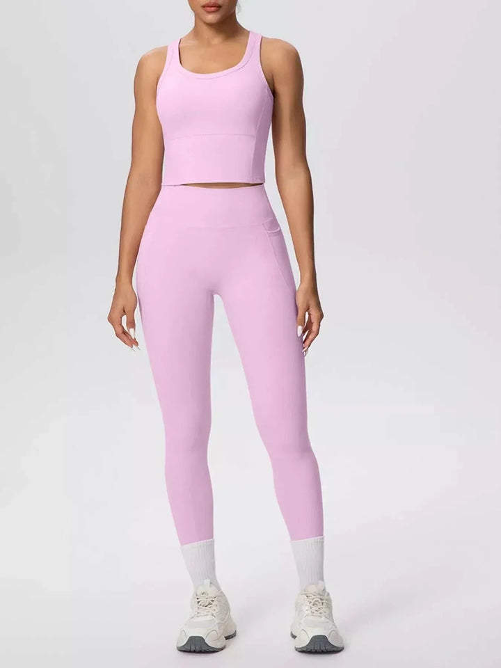 Women’s Tank and Leggings Set in solid pastel pink stretch fabric, featuring a scoop-neck cropped tank and high-waisted leggings