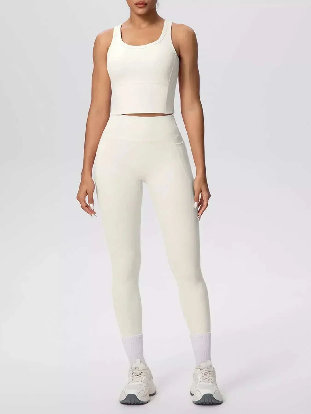 Women’s Tank and Leggings Set in cream stretch fabric, featuring a scoop-neck cropped tank and high-waisted leggings