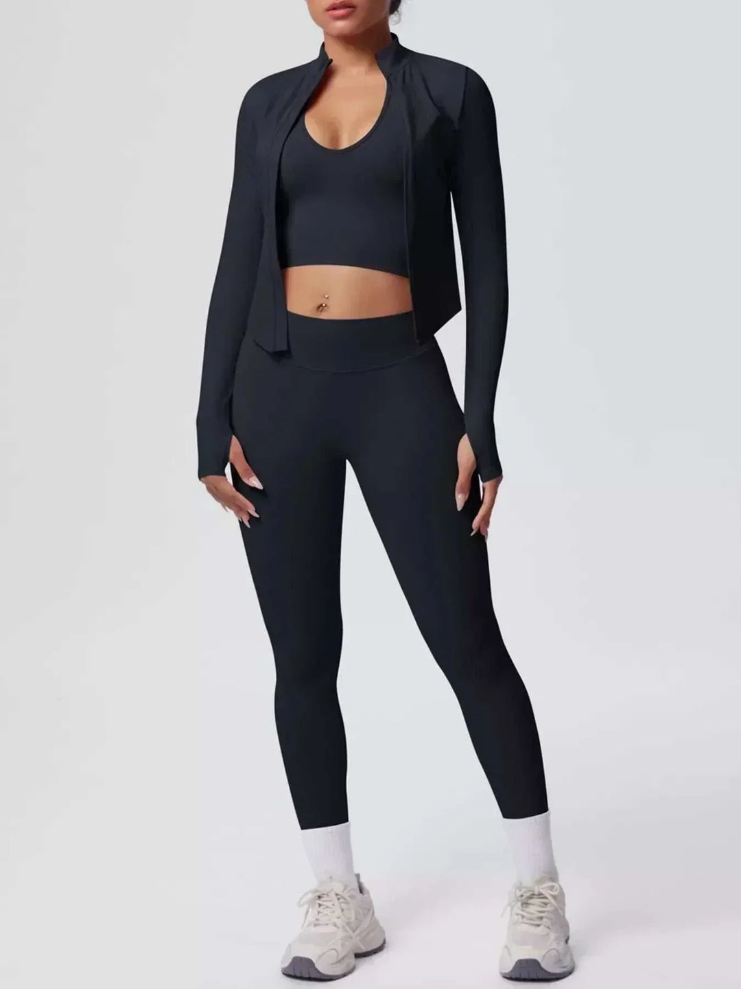 Women’s Three-Piece Activewear Set in black stretchy fabric, featuring a cropped tank, zip-up jacket and high-waisted leggings