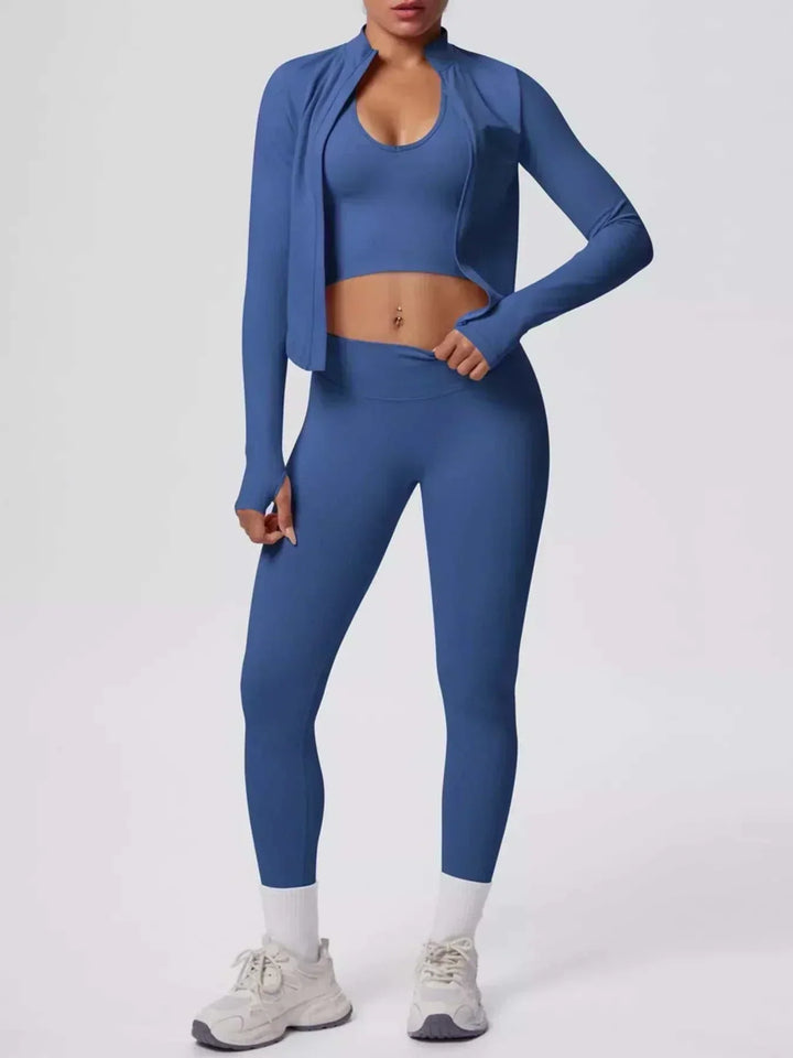 Women’s Three-Piece Activewear Set in solid blue stretch fabric, featuring a cropped tank, zip-up jacket, and leggings