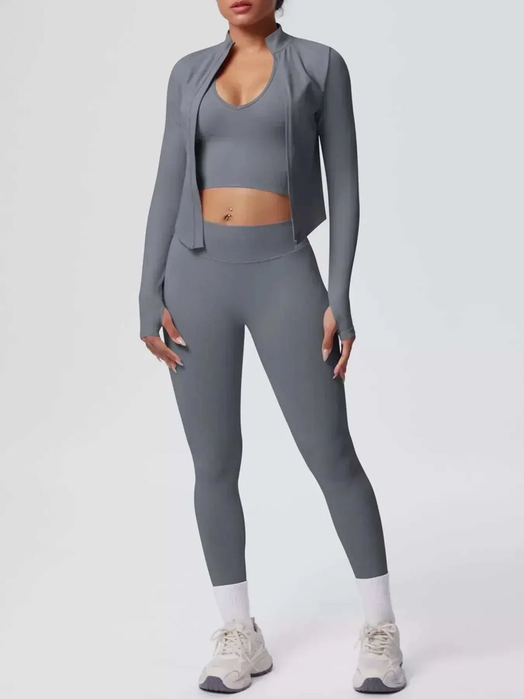 Women’s Three-Piece Activewear Set in charcoal gray stretch fabric, with a cropped tank, zip-front jacket and leggings