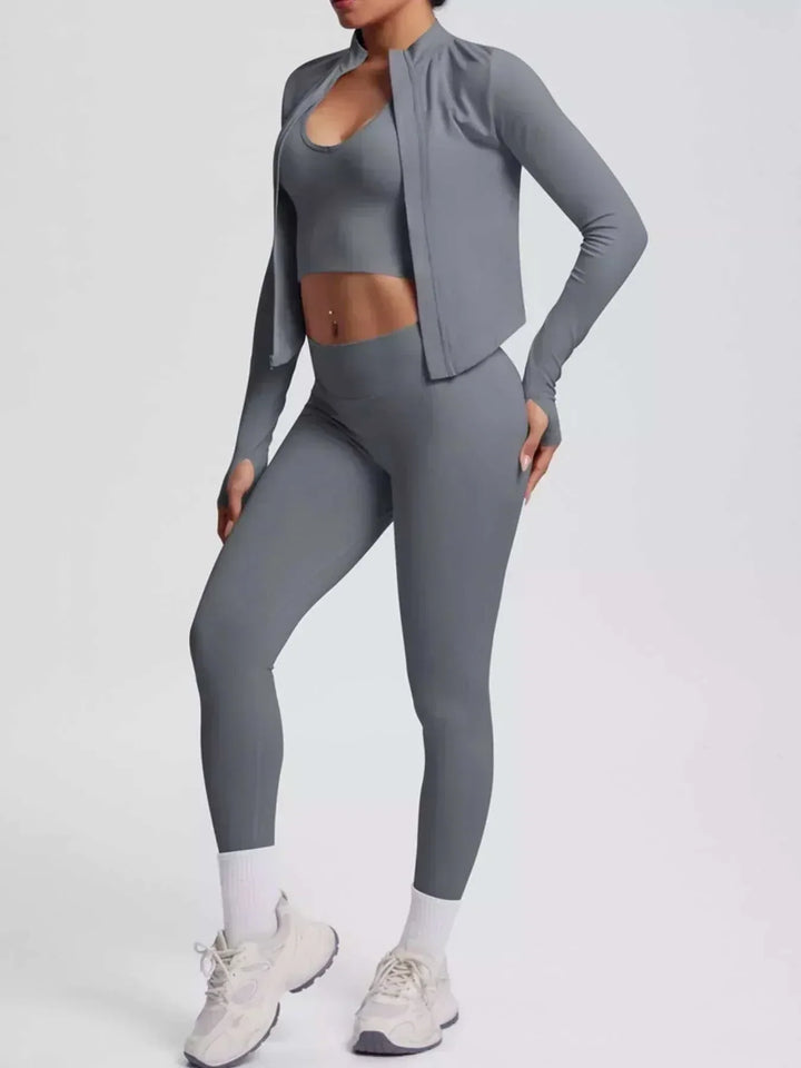 Women’s Three-Piece Activewear Set in solid gray stretch fabric, featuring a cropped zip-up jacket, sports bra and leggings