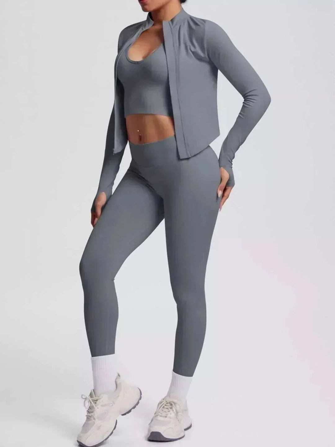 Women’s Three-Piece Activewear Set in solid slate gray stretch fabric, with a cropped zip jacket, scoop-neck tank, and leggings.