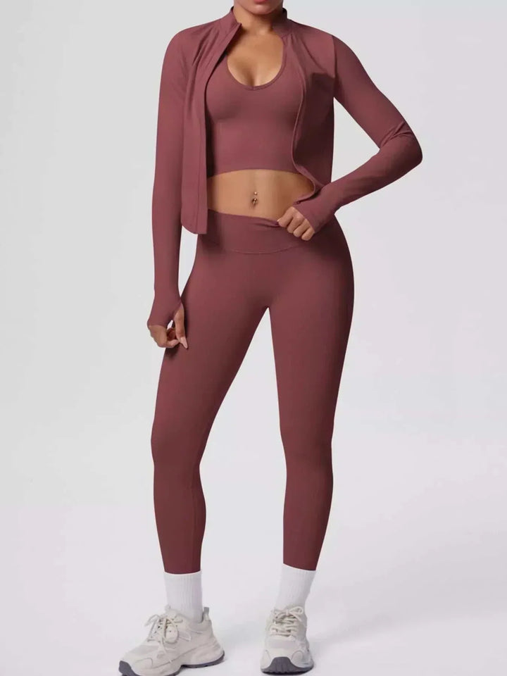 Women’s Three-Piece Activewear Set in dusty rose stretch fabric, with a scoop-neck crop tank, open zip-up jacket and leggings