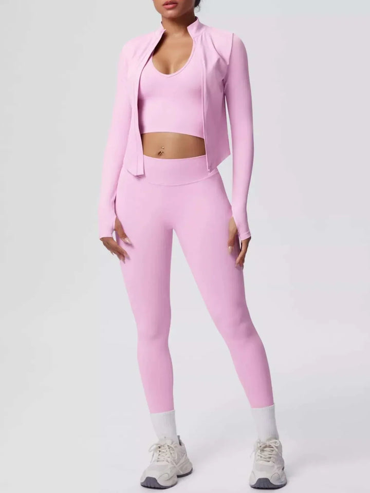 Women’s Three-Piece Activewear Set in solid pale pink stretch fabric, with a cropped tank, zip-up jacket and leggings