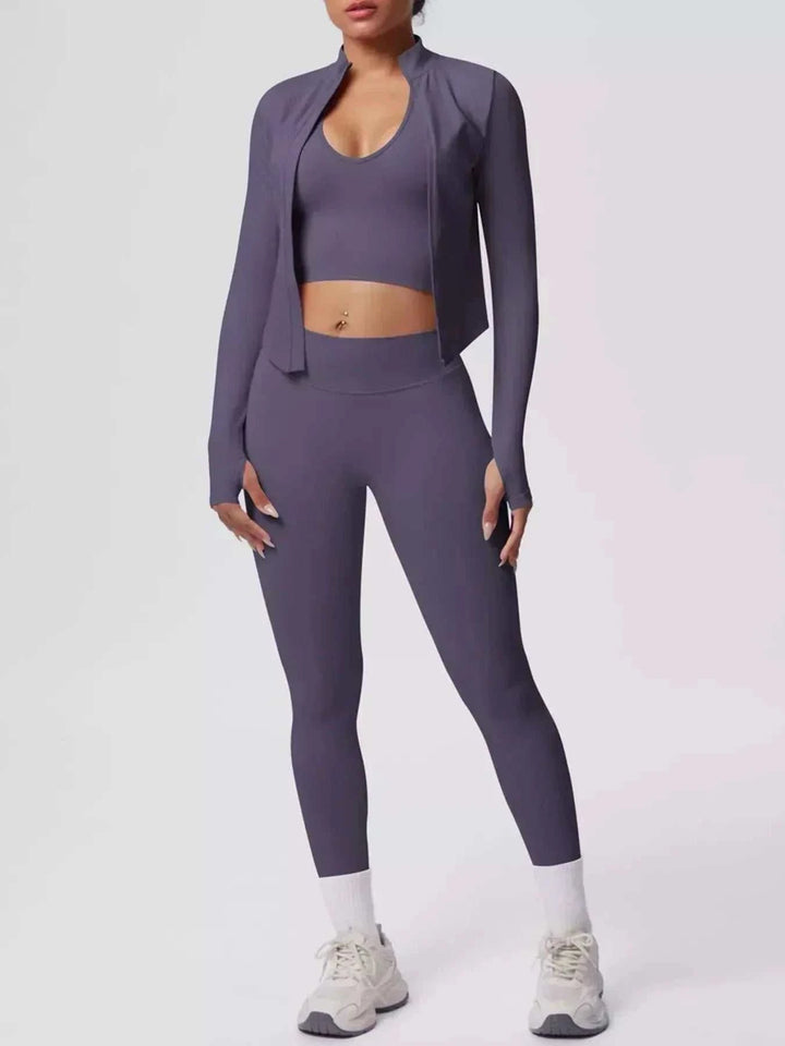 Women’s Three-Piece Activewear Set in solid muted purple stretch fabric, with a cropped tank, open zip-up jacket, and fitted leggings.