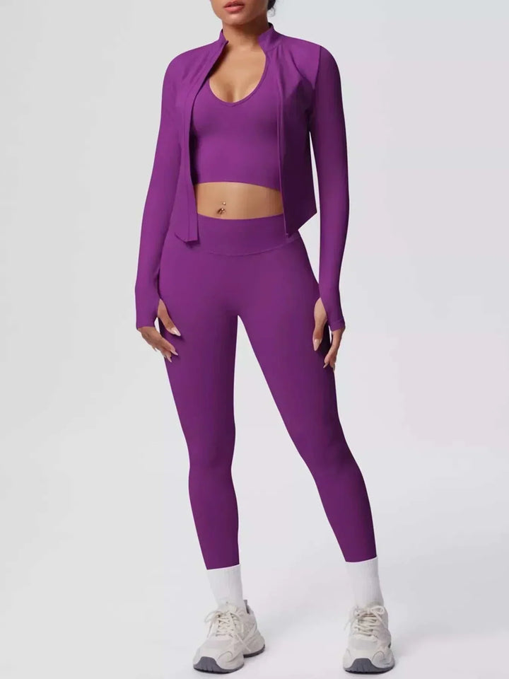 Women’s Three-Piece Activewear Set in solid purple stretch fabric, featuring a cropped tank, open zip-up jacket and leggings