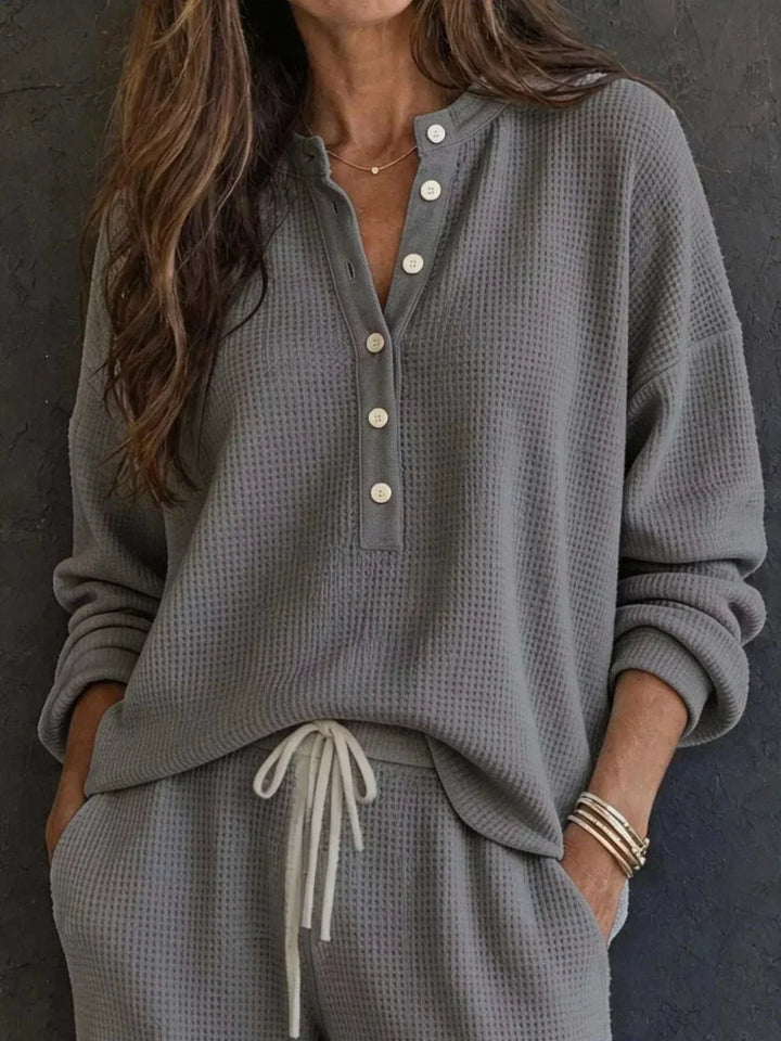 Women’s Waffle Knit Set in gray textured fabric, featuring a relaxed button-front top and matching drawstring pants.