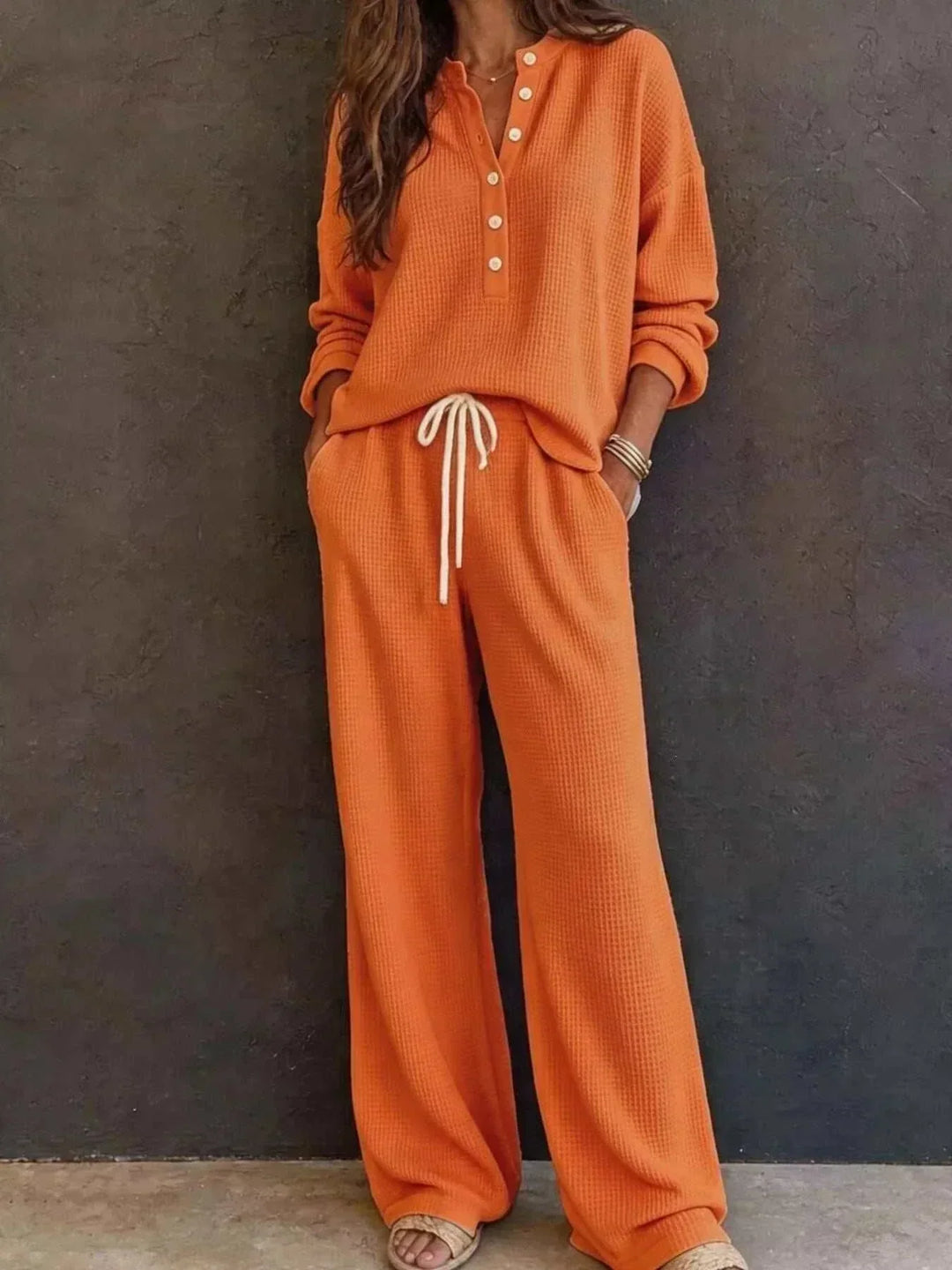 Women’s Waffle Knit Set in burnt orange textured knit, with a long-sleeve button-front top and matching drawstring pants