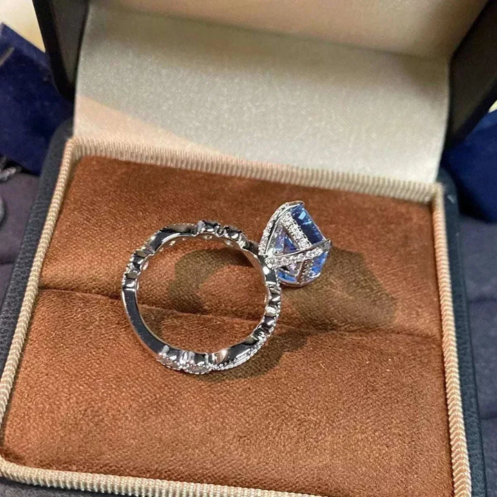 Women’s Zircon Statement Ring in silver-tone metal with blue rectangular stones and sparkling clear accents in an angular setting
