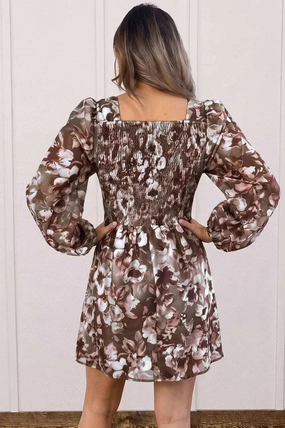 Women's abstract floral square neck long sleeve mini dress with modern print and flattering fit from Hot Topic Goods