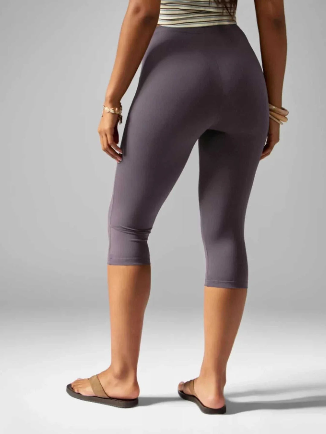 Woman wearing dark brown high-waisted Women&