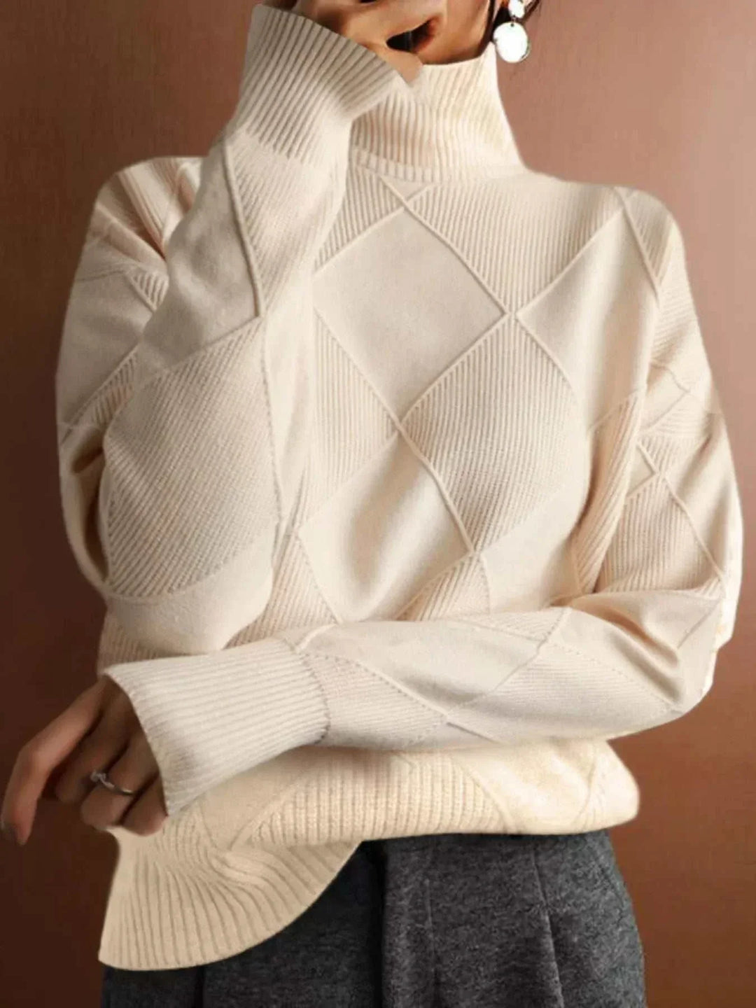 Woman wearing a Women’s Argyle Turtleneck Sweater with classic knit design and cozy long sleeves