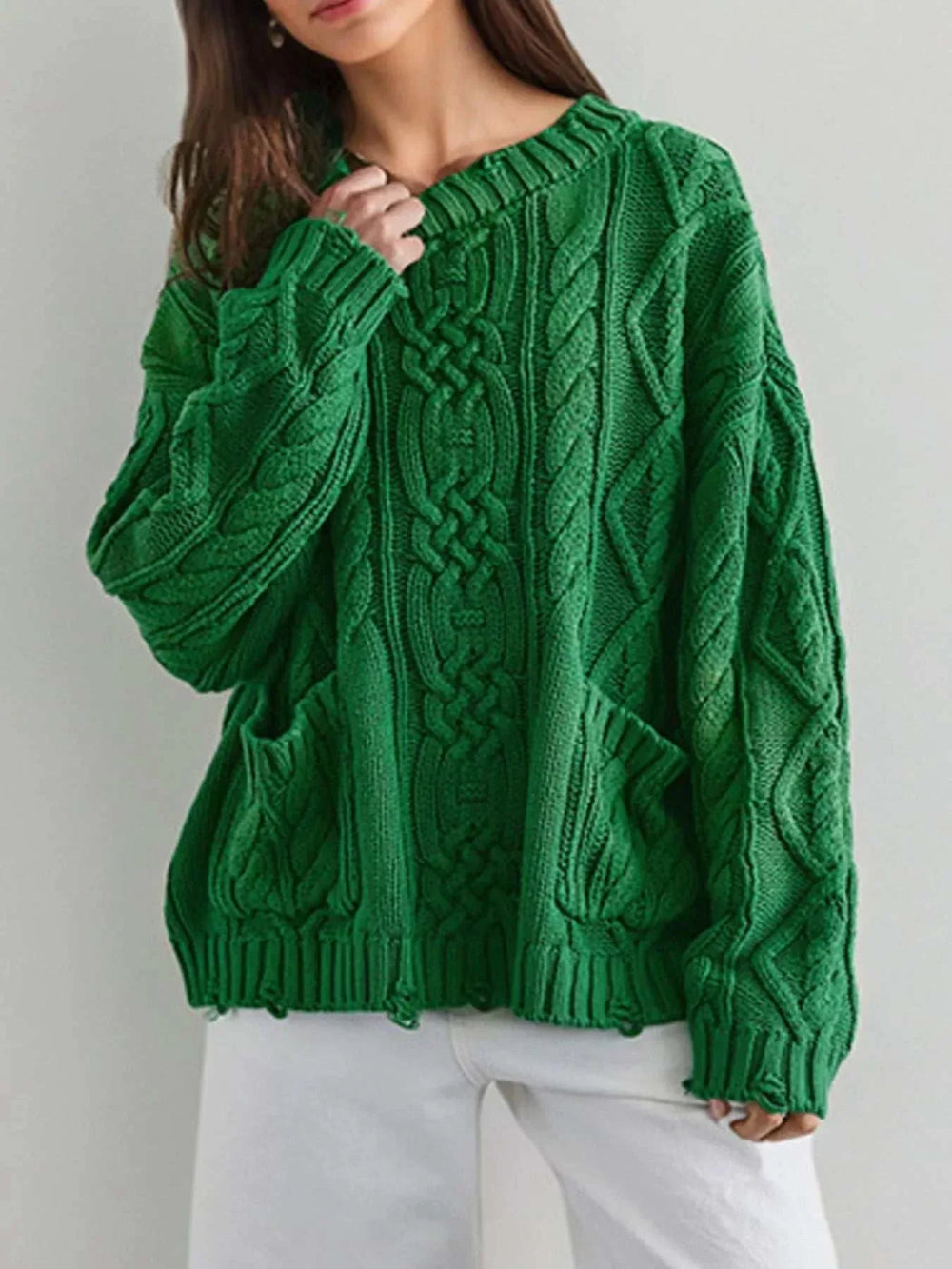 women wearing Women’s Cable-Knit Pocket Sweater from Hot Topic Goods in casual fall outfit