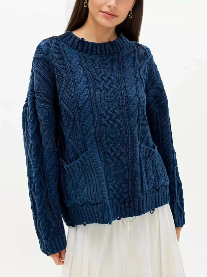 women wearing a cozy women’s cable-knit pocket sweater from Hot Topic Goods in a casual fall outfit