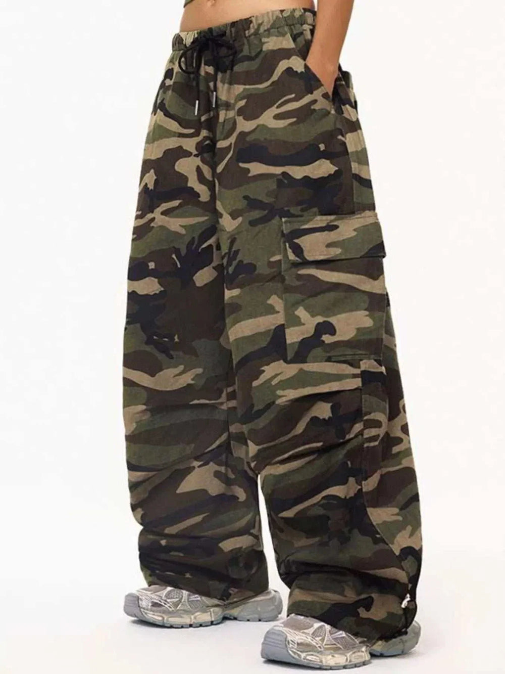 Women's camouflage cargo pants with adjustable drawstring waist and relaxed fit from Hot Topic Goods