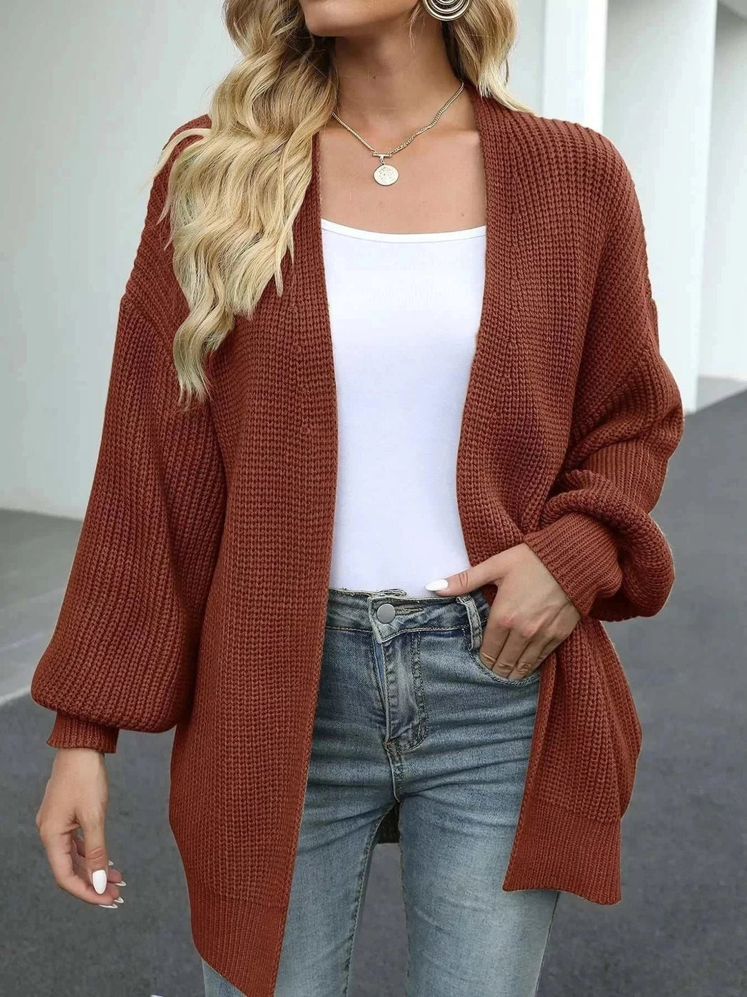 Women’s chunky knit cardigan with open-front design and long sleeves from Hot Topic Goods