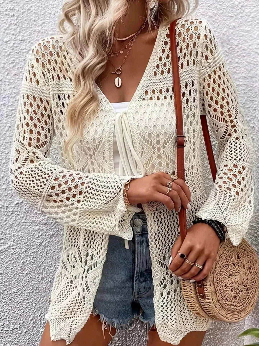 Women’s Crochet Tie-Front Cardigan from Hot Topic Goods lightweight open-knit sweater with tie-front closure ideal for spring and summer layering