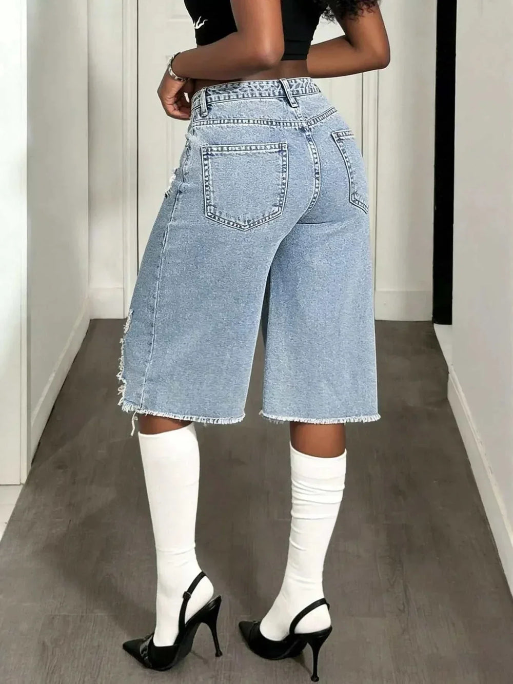 Women's distressed denim shorts with wide-leg silhouette and edgy frayed details from Hot Topic Goods