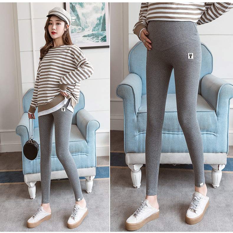 Pregnant woman wearing fleece-lined maternity leggings for cold weather