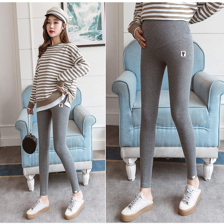 Pregnant woman wearing fleece-lined maternity leggings for cold weather