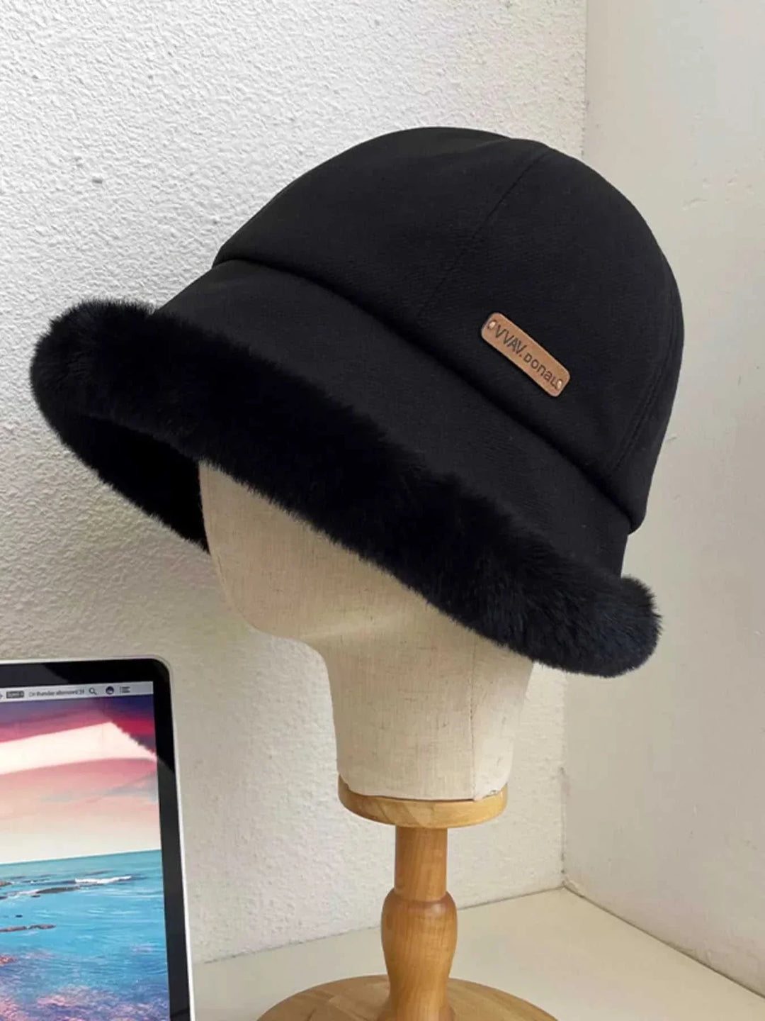 Women’s Fuzzy Trim Bucket Hat with soft fuzzy trim and classic bucket silhouette for fall and winter fashion from Hot Topic Goods