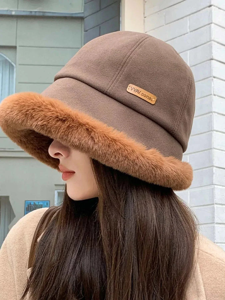 Women’s fuzzy trim bucket hat with cozy polyester material and classic silhouette from Hot Topic Goods