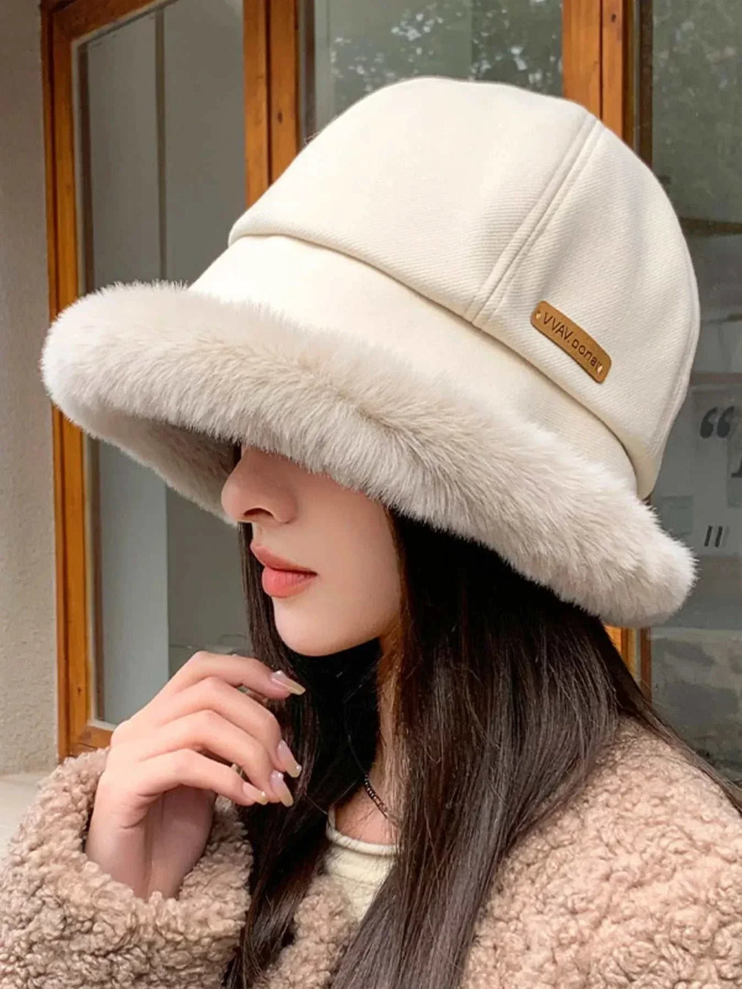 Women's fuzzy trim bucket hat with cozy polyester material and classic silhouette for fall and winter from Hot Topic Goods