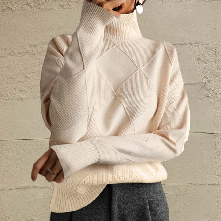 Women’s geometric turtleneck sweater with long sleeves and bold pattern from Hot Topic Goods