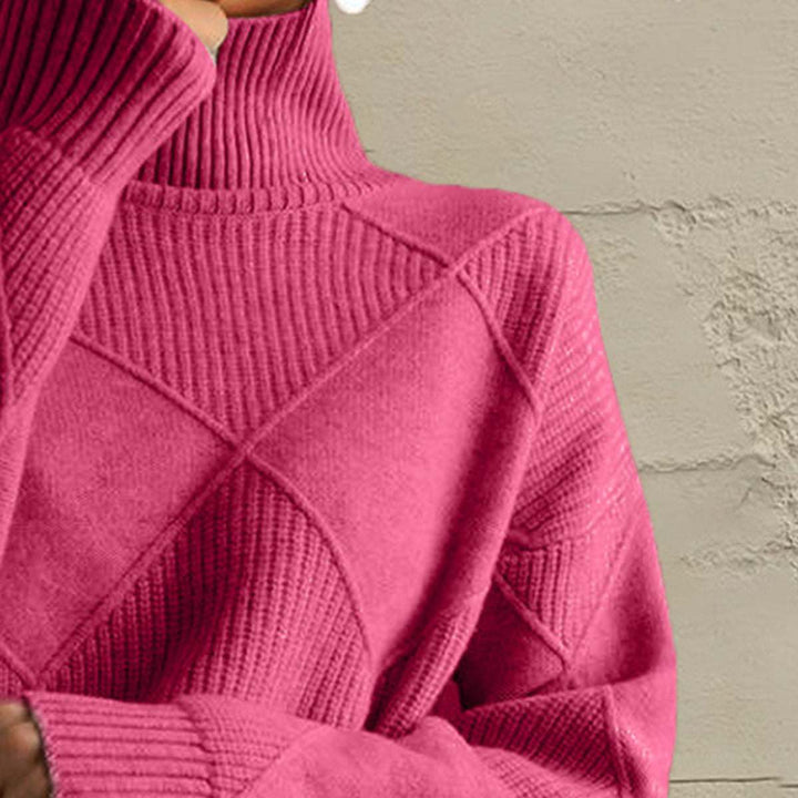 Women’s geometric turtleneck sweater with long sleeves and bold pattern from Hot Topic Goods