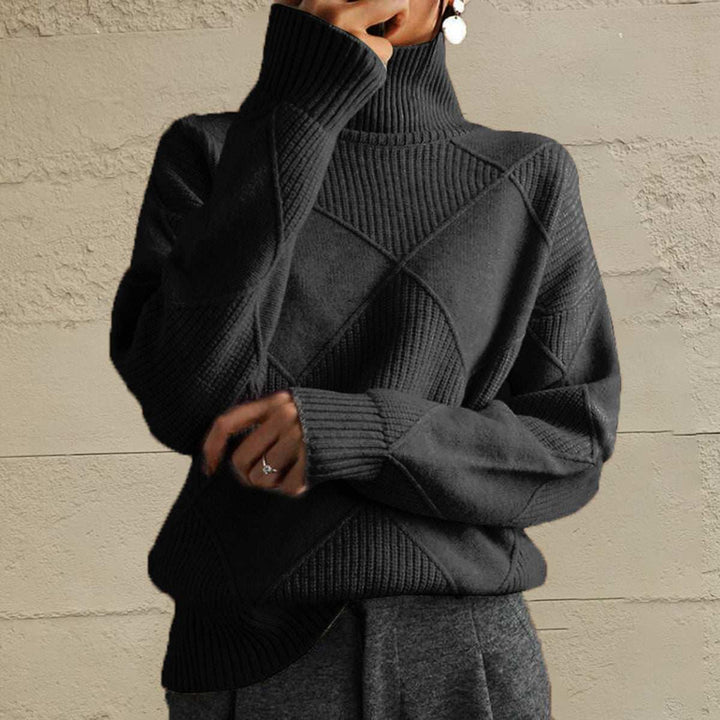Women’s geometric turtleneck sweater with long sleeves and bold pattern from Hot Topic Goods