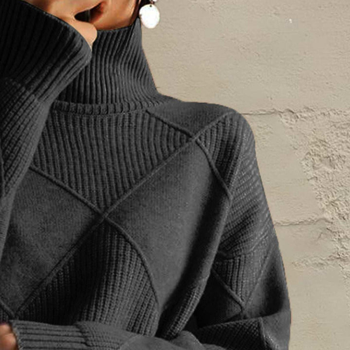Women’s geometric turtleneck sweater with long sleeves and bold pattern from Hot Topic Goods