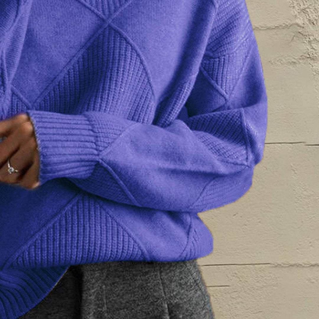 Women’s geometric turtleneck sweater with long sleeves and bold pattern from Hot Topic Goods