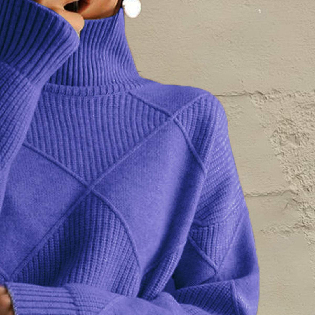 Women’s geometric turtleneck sweater with long sleeves and bold knit pattern from Hot Topic Goods