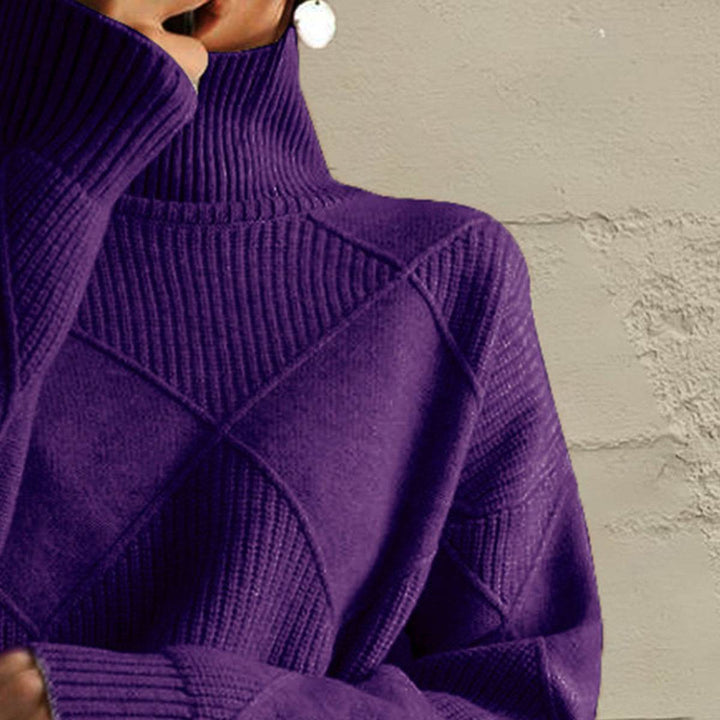 Women’s geometric turtleneck sweater with long sleeves and bold pattern from Hot Topic Goods