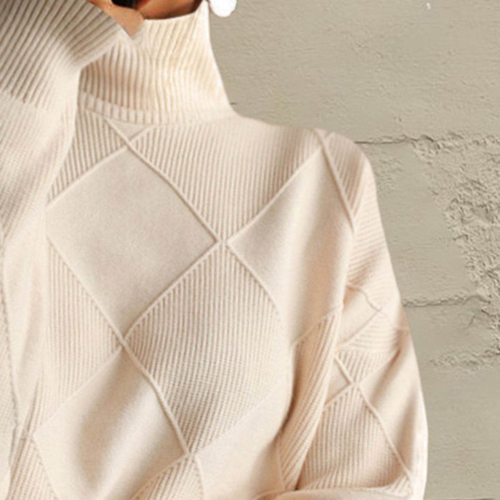 Women’s geometric turtleneck sweater with long sleeves and bold pattern from Hot Topic Goods