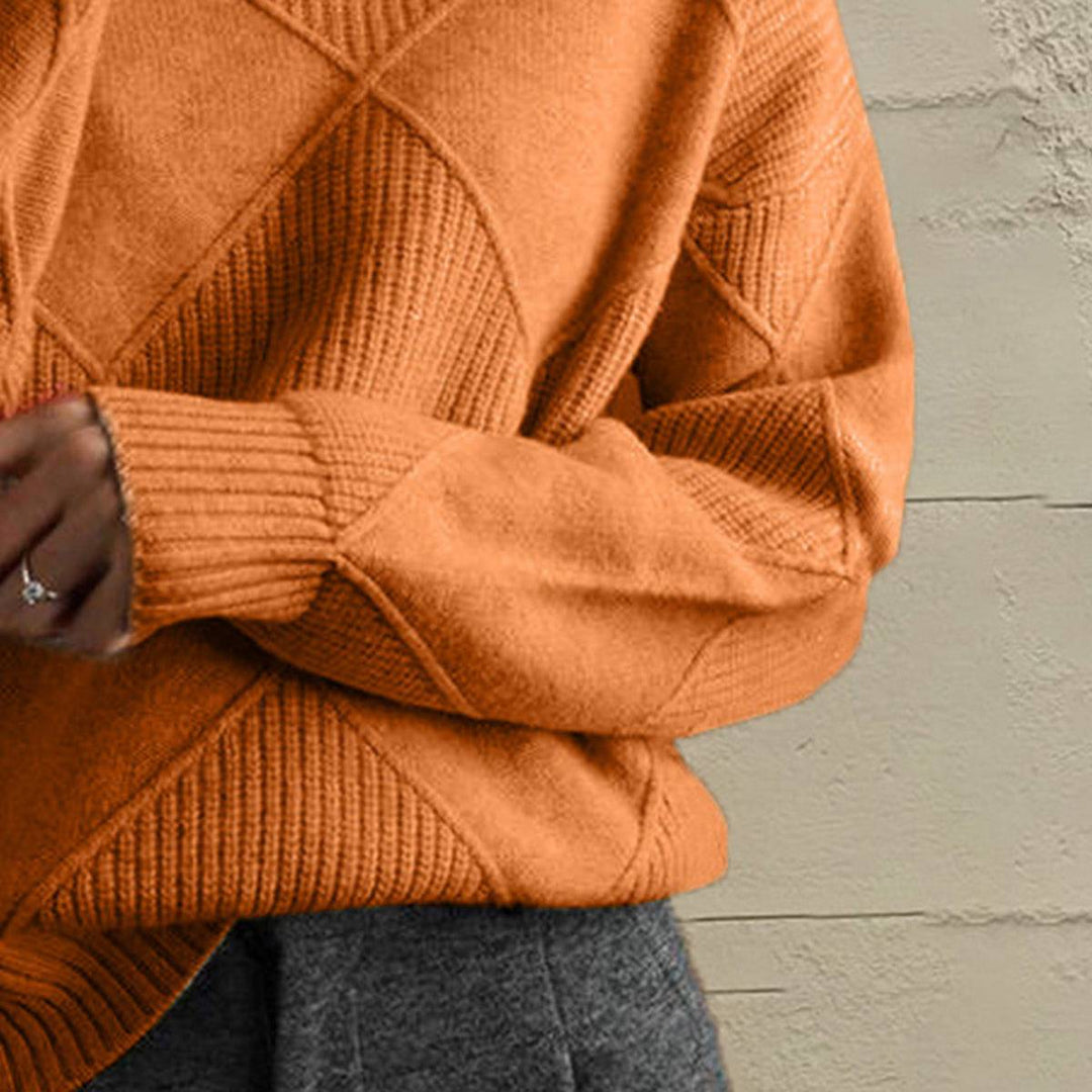 Women’s geometric turtleneck sweater with long sleeves and bold pattern from Hot Topic Goods