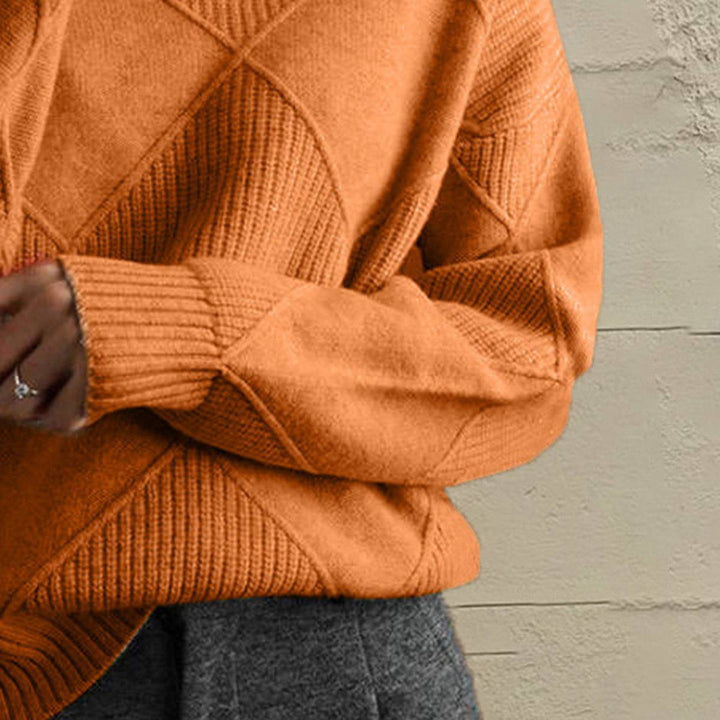 Women’s geometric turtleneck sweater with long sleeves and bold pattern from Hot Topic Goods