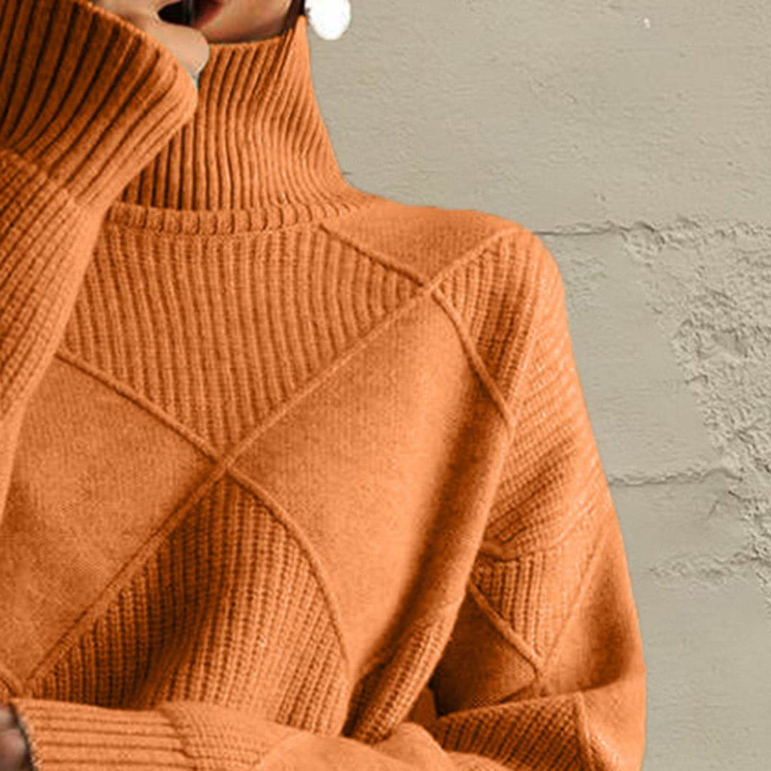 Women’s geometric turtleneck sweater with long sleeves and bold pattern from Hot Topic Goods
