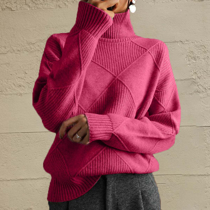 Woman wearing a Women’s Geometric Turtleneck Sweater with long sleeves and bold geometric pattern from Hot Topic Goods