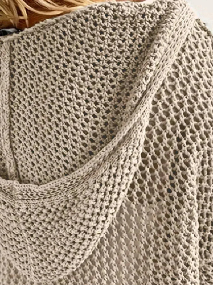 Women’s hooded knit cover-up in openwork design with long sleeves and hood, styled for beachwear and casual summer outings